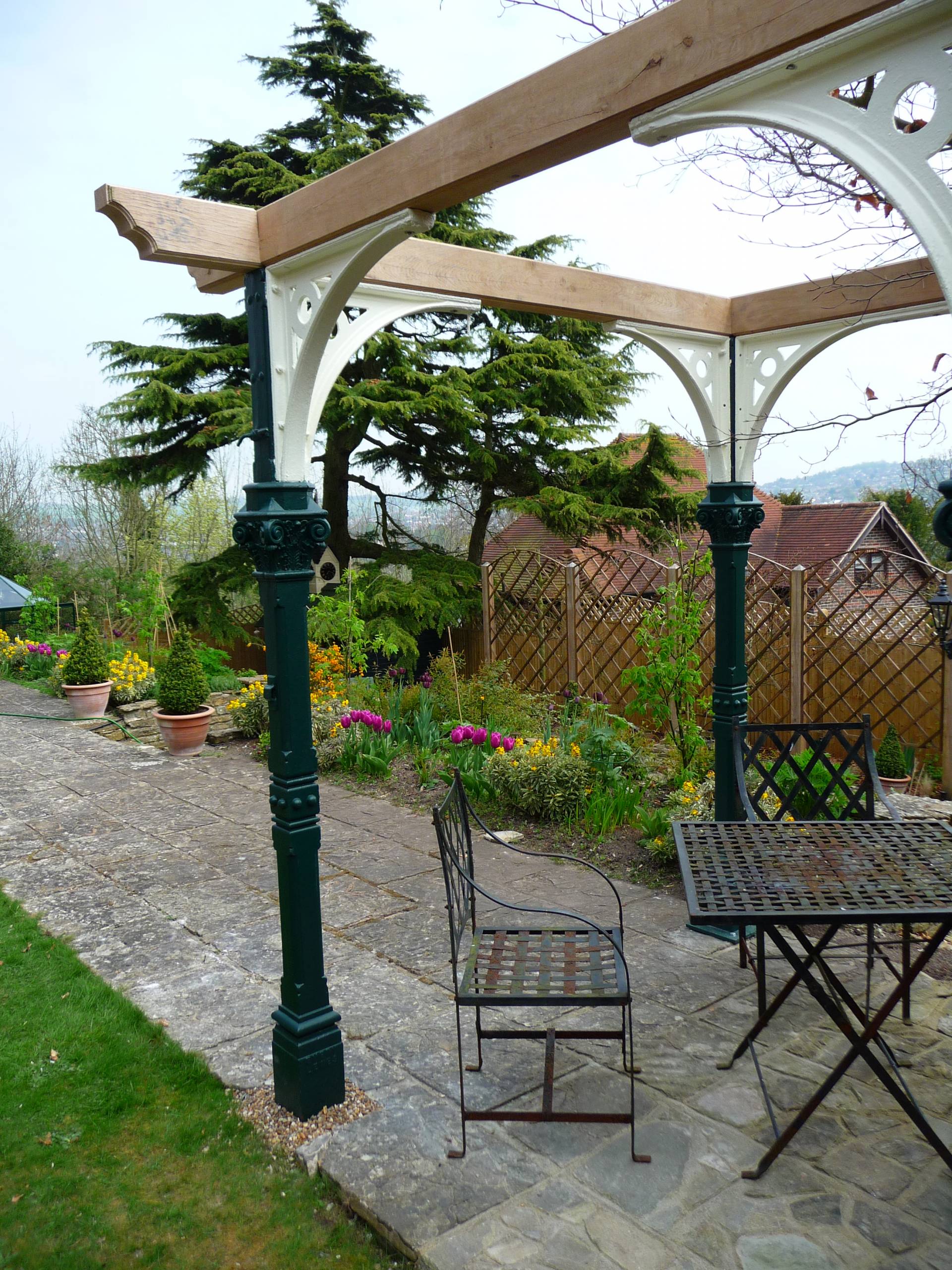 Reclaimed pillars from the West Pier in Brighton restored and installed into a garden in Withdean
